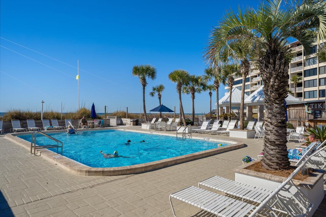 Guests swimming in one of the outdoor pools