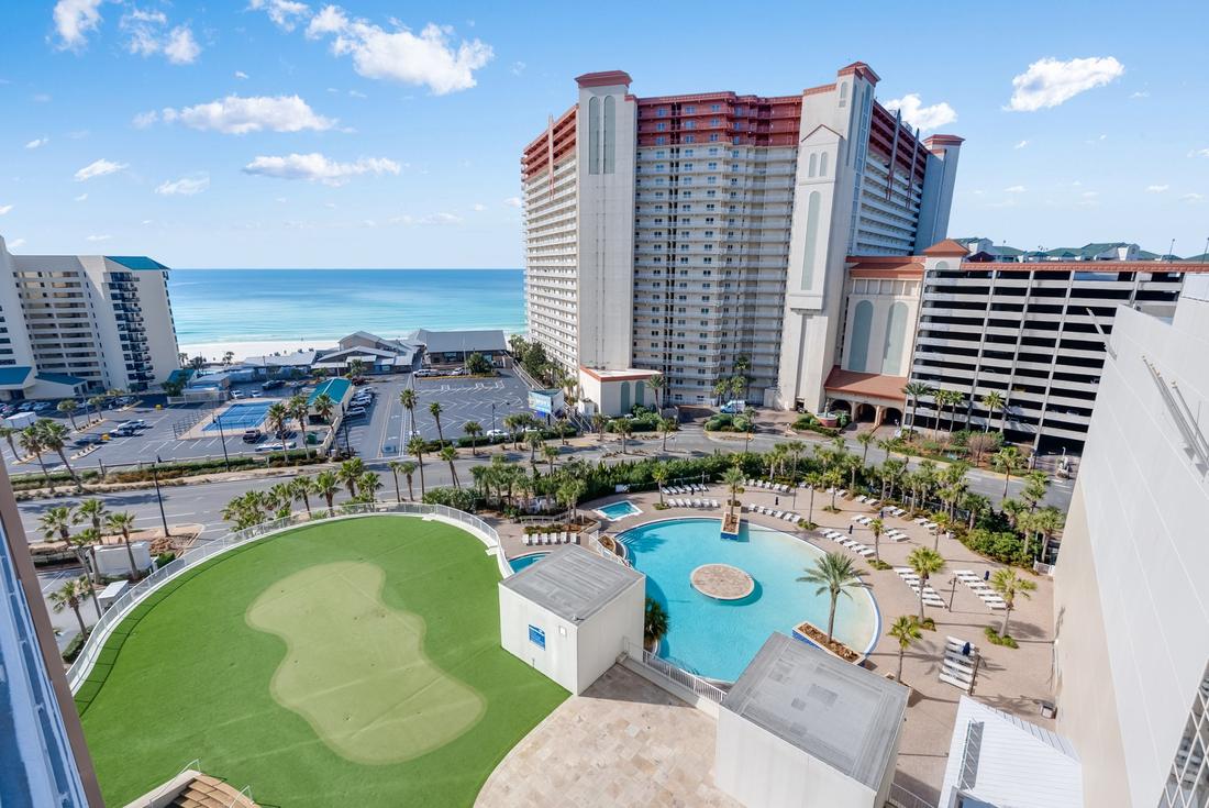 Putting green and pools with the Gulf beyond
