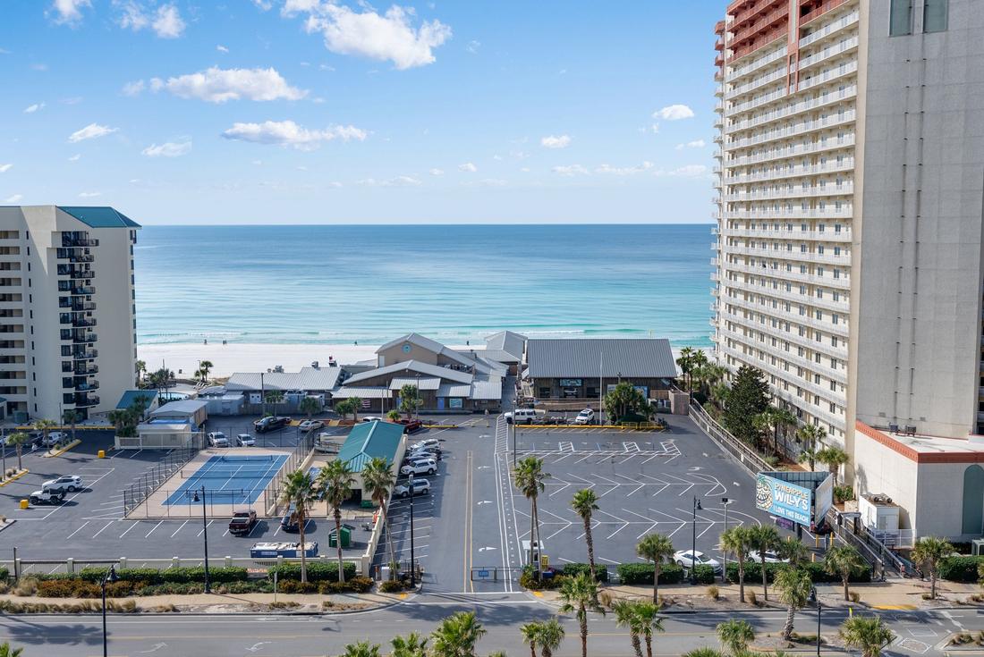 Tennis courts with the Gulf behind