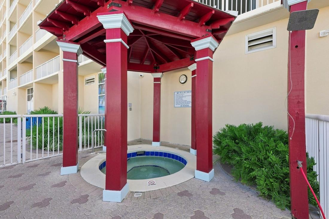 Hot tub under the red gazebo