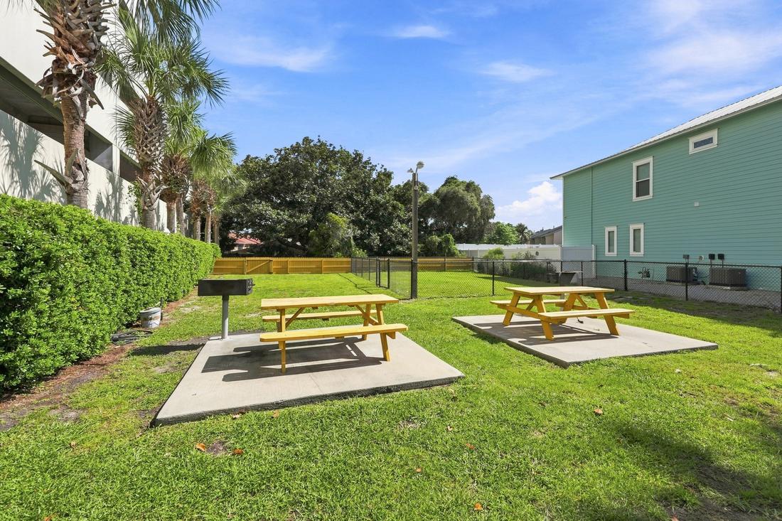 Lawn with picnic tables and grills