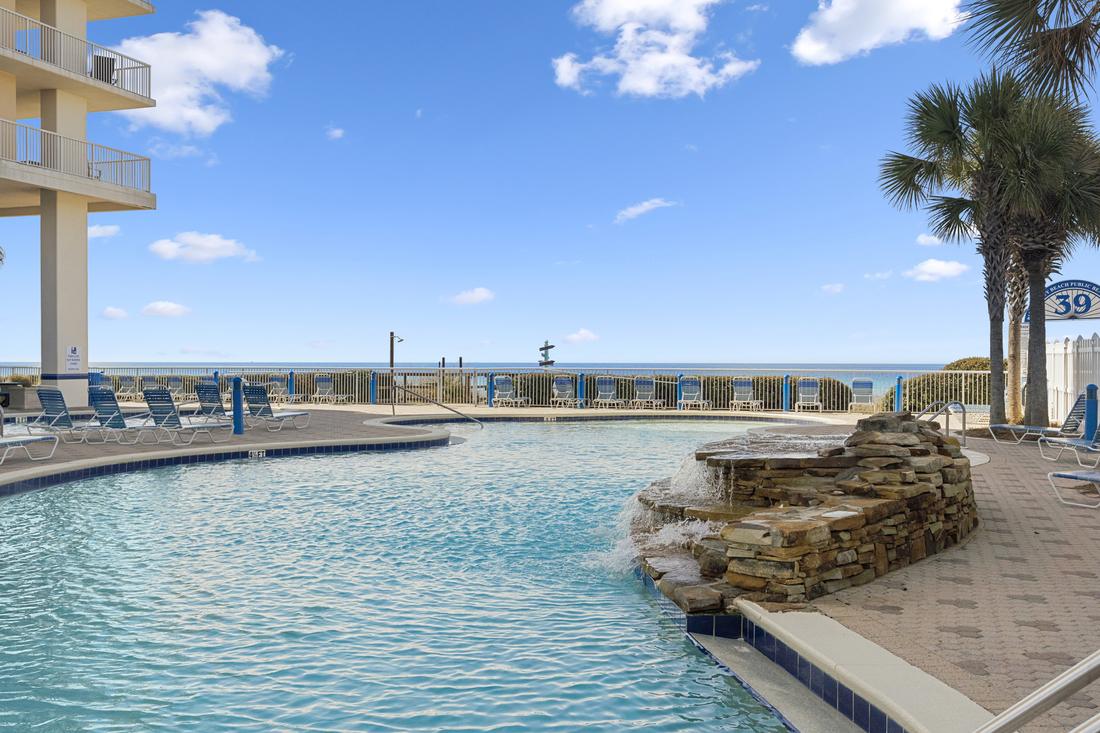 Pool with rock waterfall feature