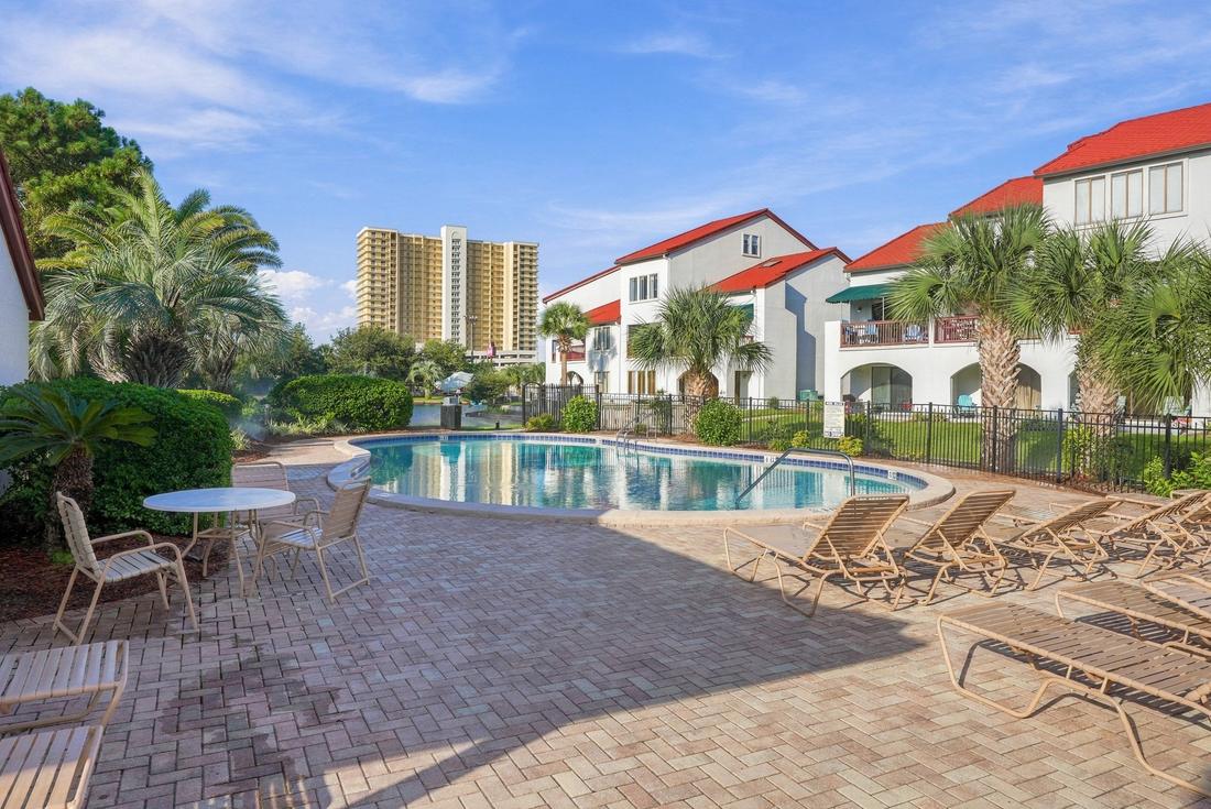 Pool deck with loungers and tables
