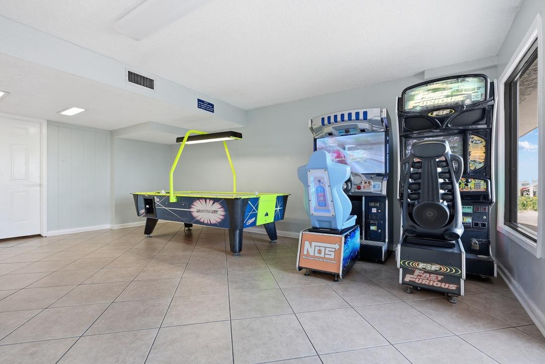 Game room with air hockey and arcade machines