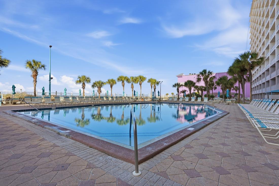 Palm-lined Gulf-front pool at the Summit